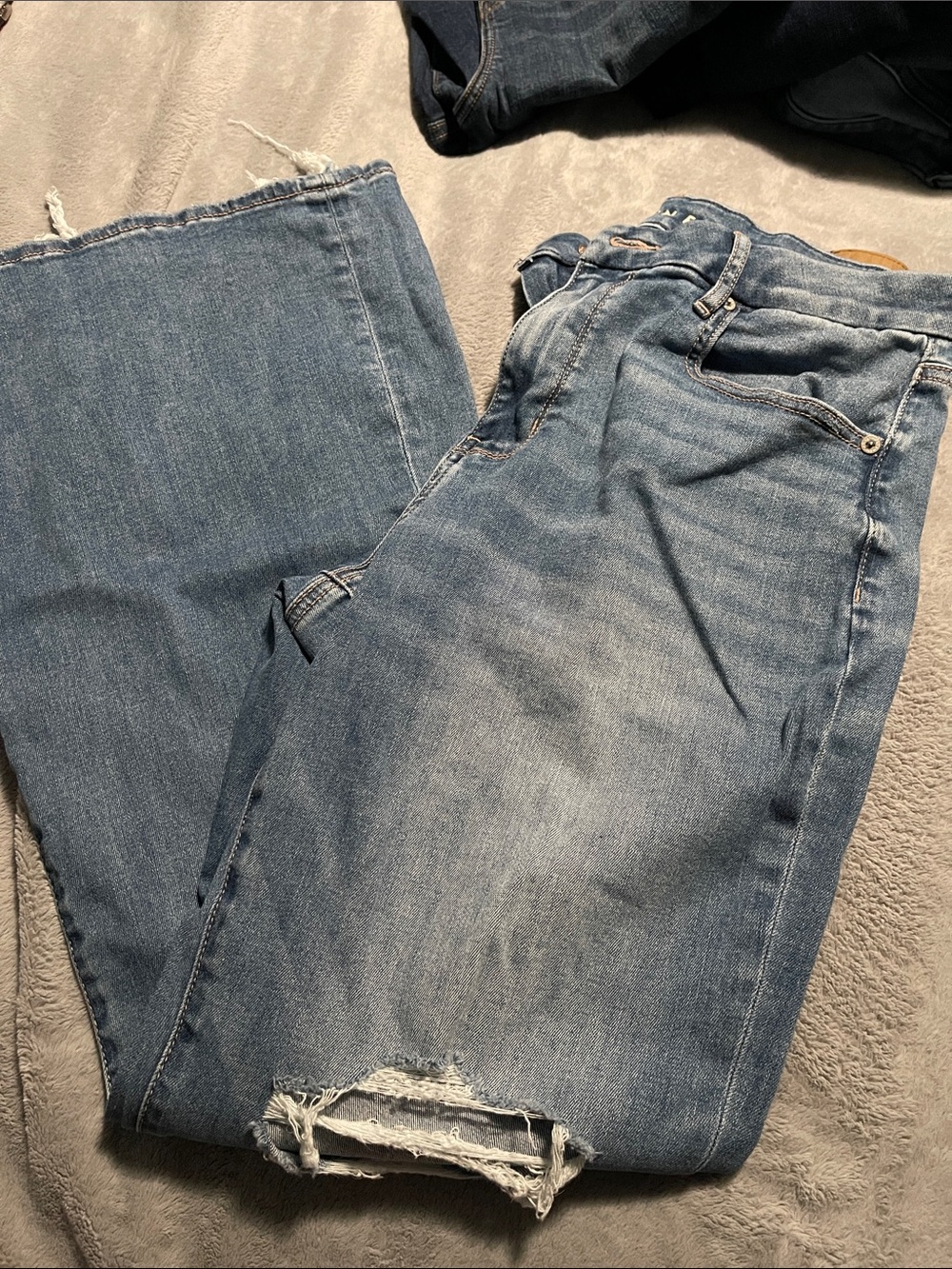 American Eagle Outfitters Light Wash Flare Jeans with Distressed Hem